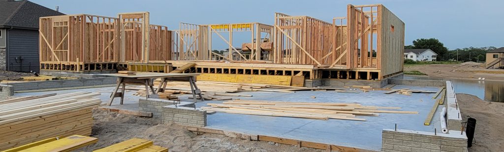 Construction Progress house being framed, construction progress, framing, construction process, skilled workers, craftsmanship, construction services, construction company